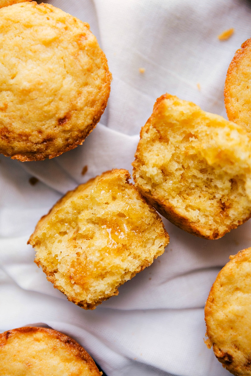 Overhead image of Cornbread Muffins, baked and split in half, showing the inside