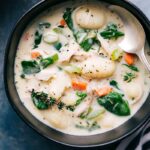 Warm chicken gnocchi soup in a bowl, steamy and inviting, perfect for serving on a cold day.