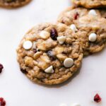 Freshly baked oatmeal cranberry cookies with white chocolate chips and dried cranberries, straight from the oven and ready to delight.