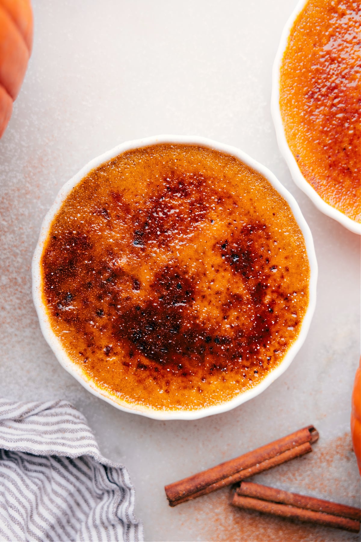 Golden caramelized sugar crust atop creamy Pumpkin Créme Brûleé in a ramekin.