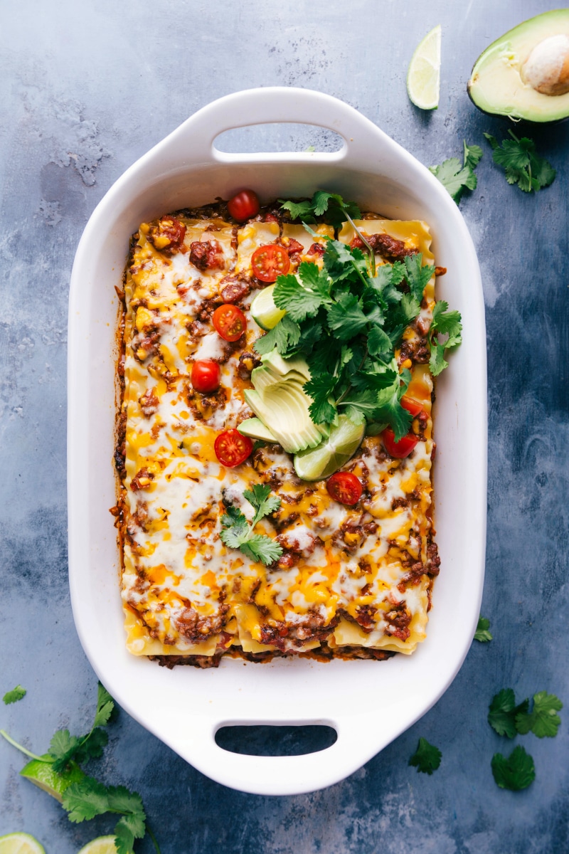 Overhead image of Taco Lasagna fresh out of the oven with toppings on it.