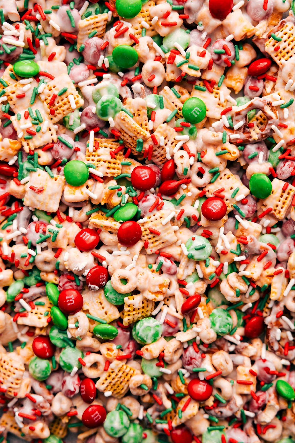 Festive and fun Christmas Snack Mix with M&Ms and sprinkles ready to be enjoyed.