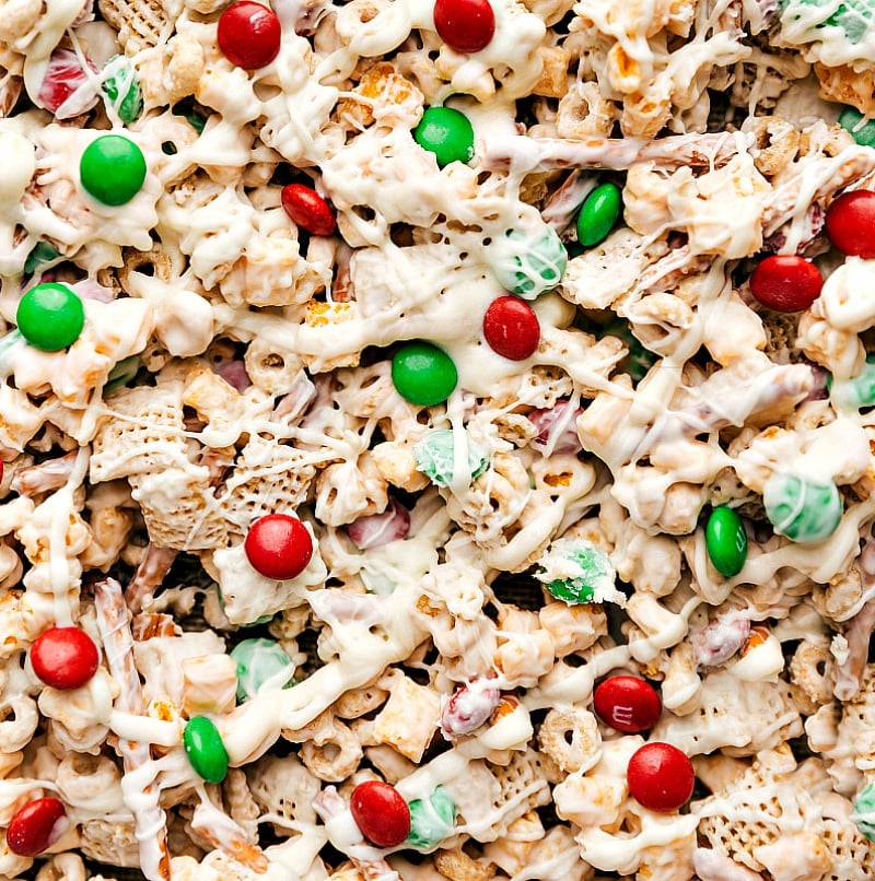 Christmas snack mix, now coated in white chocolate, thoroughly mixed together.