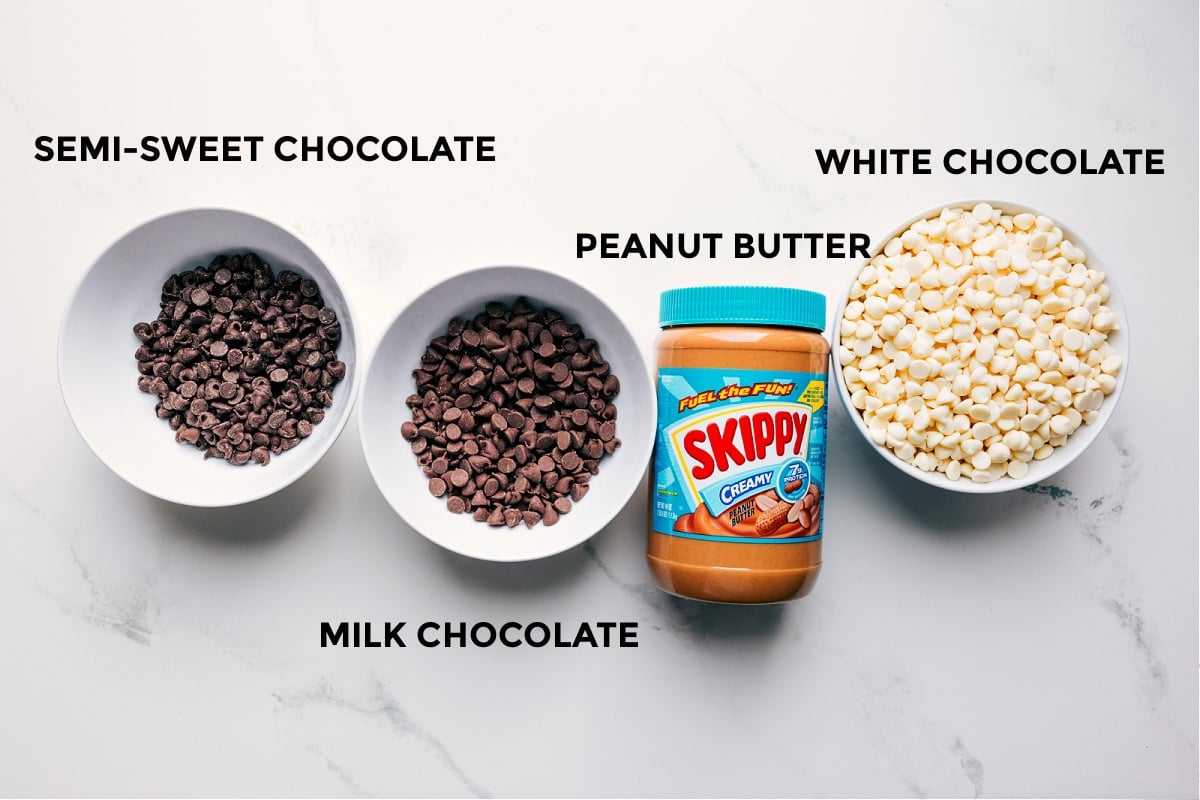 The three simple ingredients set out for easy assembly including the milk chocolate, peanut butter, and white chocolate.