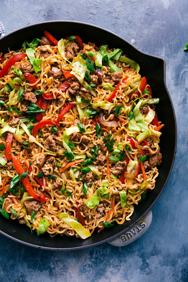 Delicious Egg Roll Noodles Garnished with Green Onions in Skillet Completed Egg Roll Noodles in a large skillet, beautifully garnished with fresh green onions.