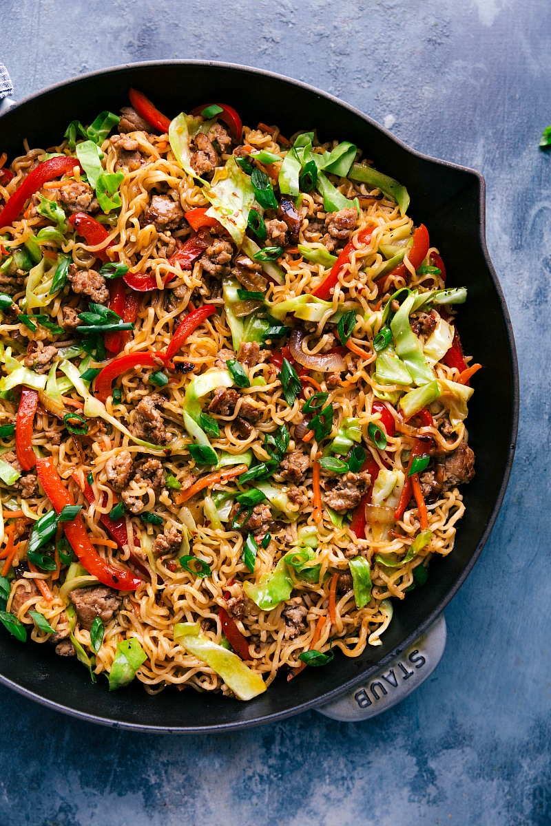 Finished Egg Roll Noodles in a large skillet garnished with green onions.