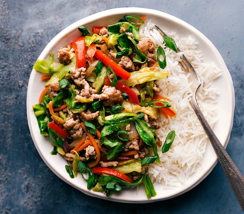 Egg roll in a bowl filling served over a bed of rice, prepared and ready for a delicious meal.