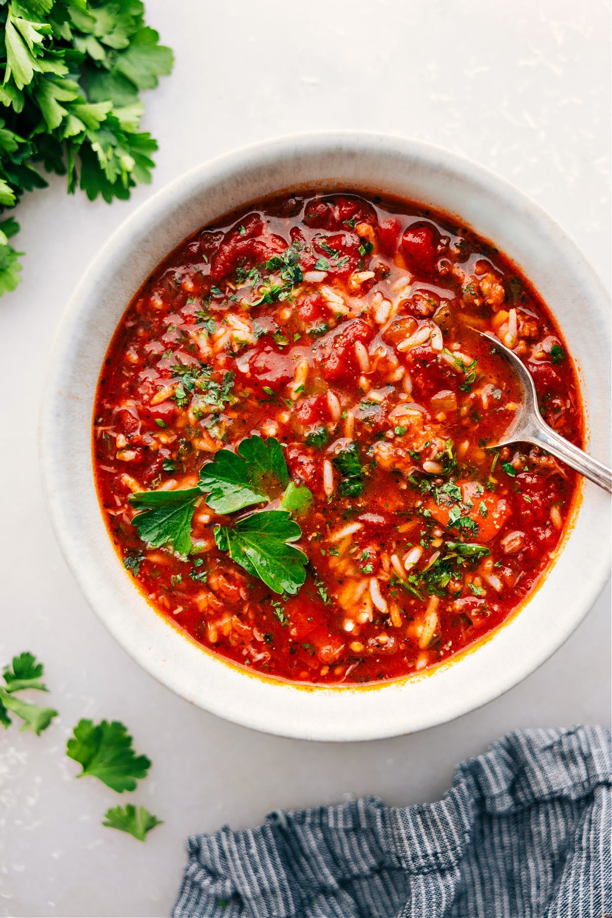 The Best Stuffed Pepper Soup Stuffed Pepper Soup in a bowl, topped with fresh parsley and grated Parmesan.