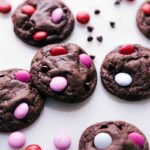 Freshly baked cookies adorned with colorful Valentine's M&M's.