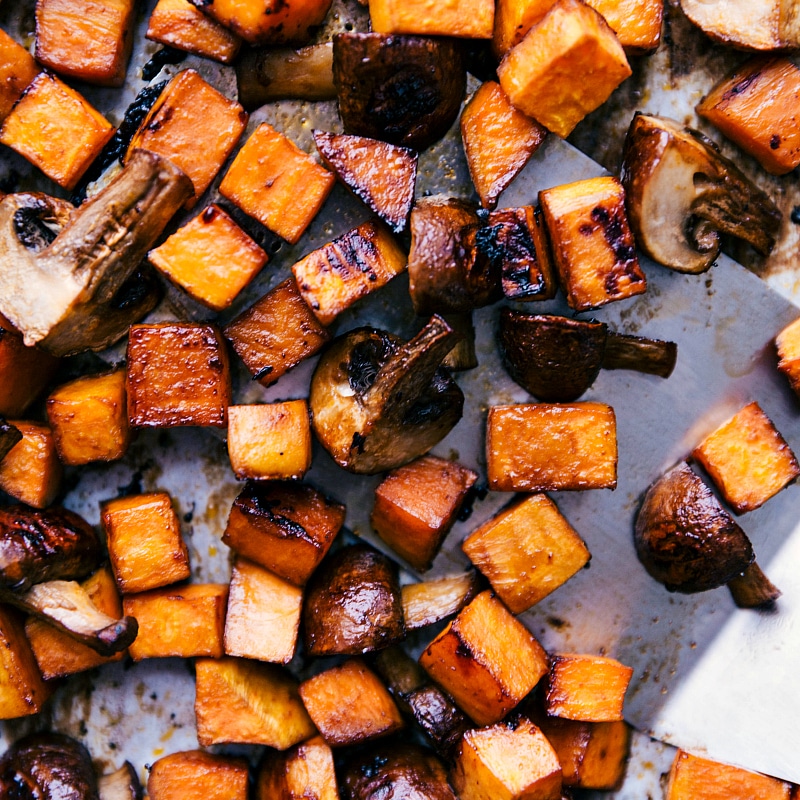 Freshly roasted sweet potatoes and mushrooms, hot out of the oven, prepared for the wraps.