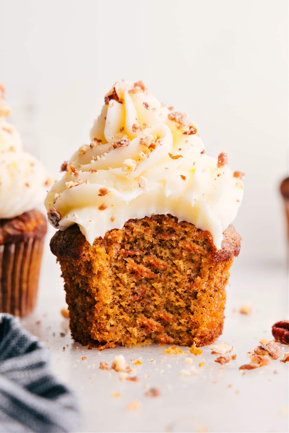 A big bite out of carrot cake muffins.