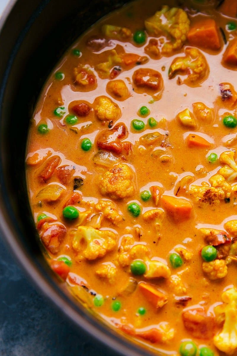 View of the finished pot of Vegetable Curry, loaded with healthy vegetables and simmered in a rich coconut curry broth.