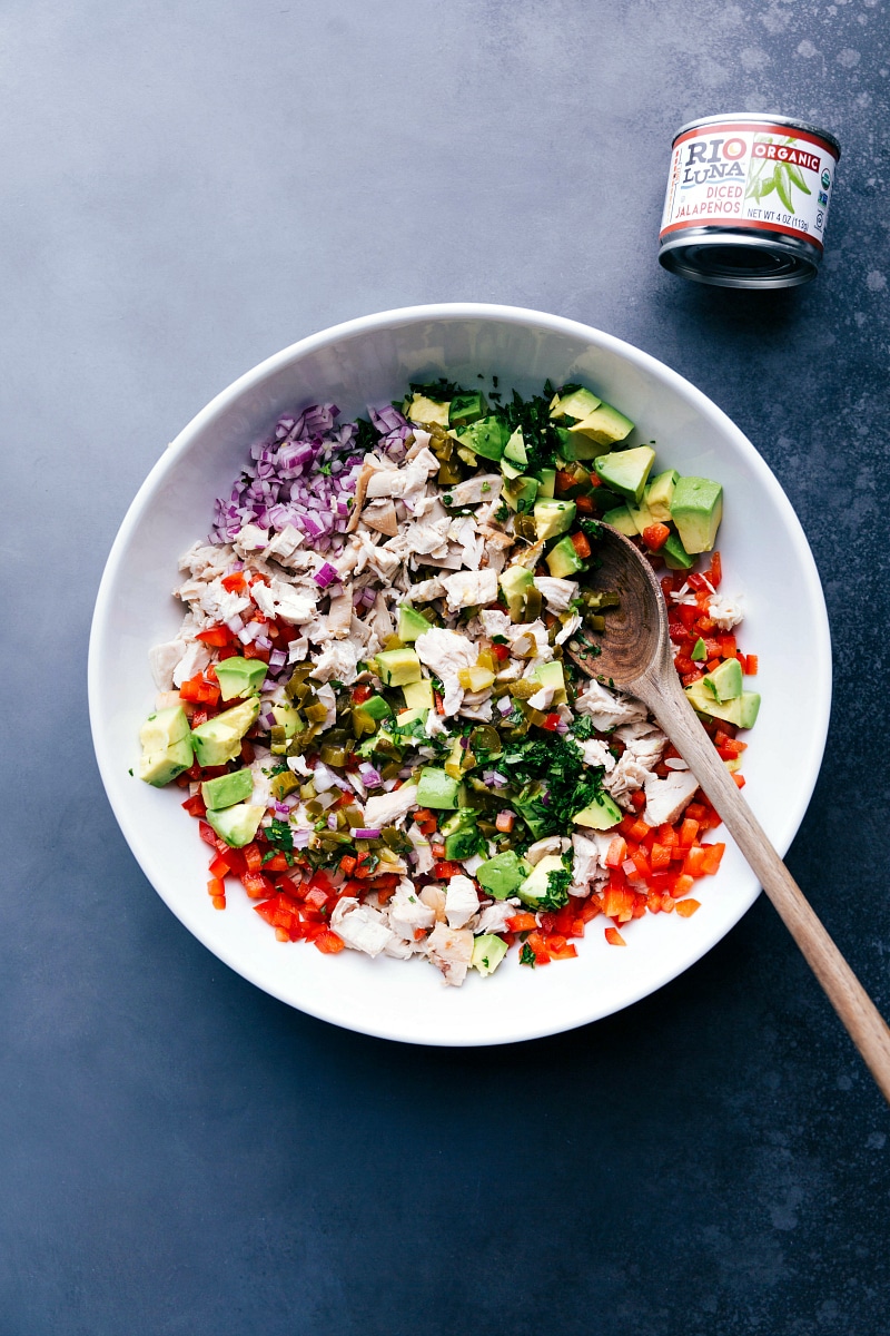 Image of a bowl of all the ingredients mixed together for these Jalapeño Chicken Salad Sandwiches