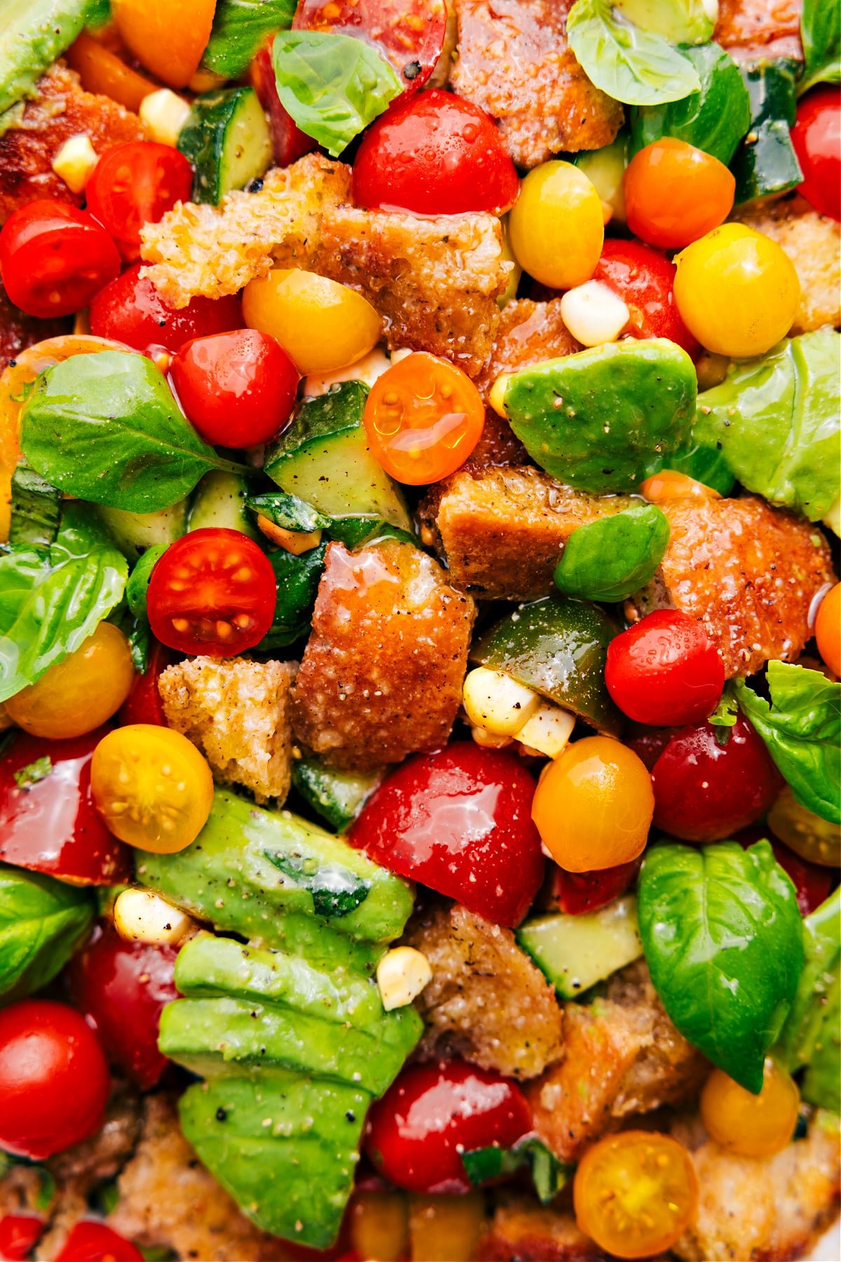 The salad is in a bowl with dressing on top, ready to be enjoyed.