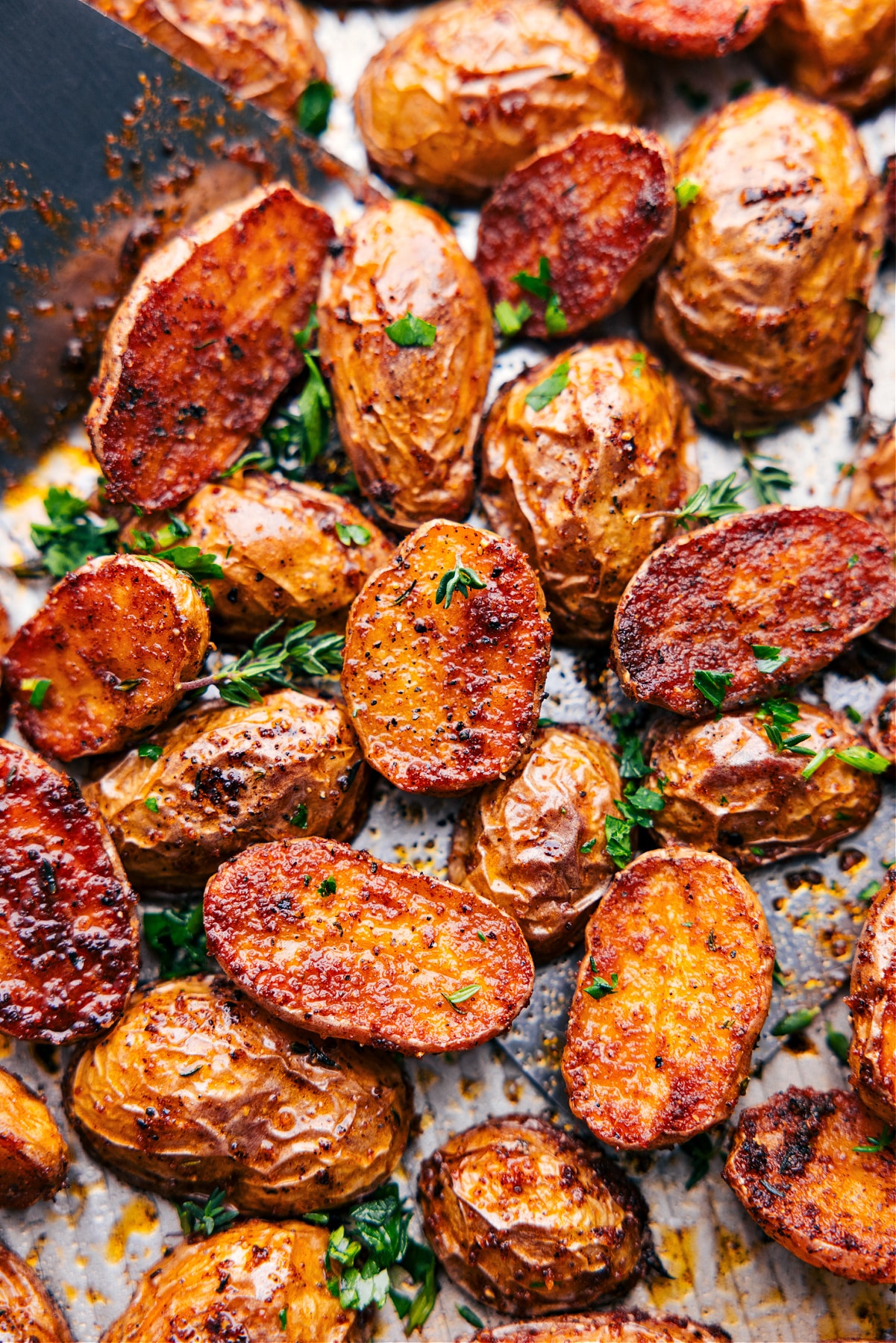 Tray full of roasted potatoes.