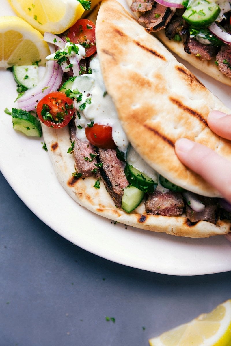 Image of Steak Gyros with everything inside, ready to be eaten.