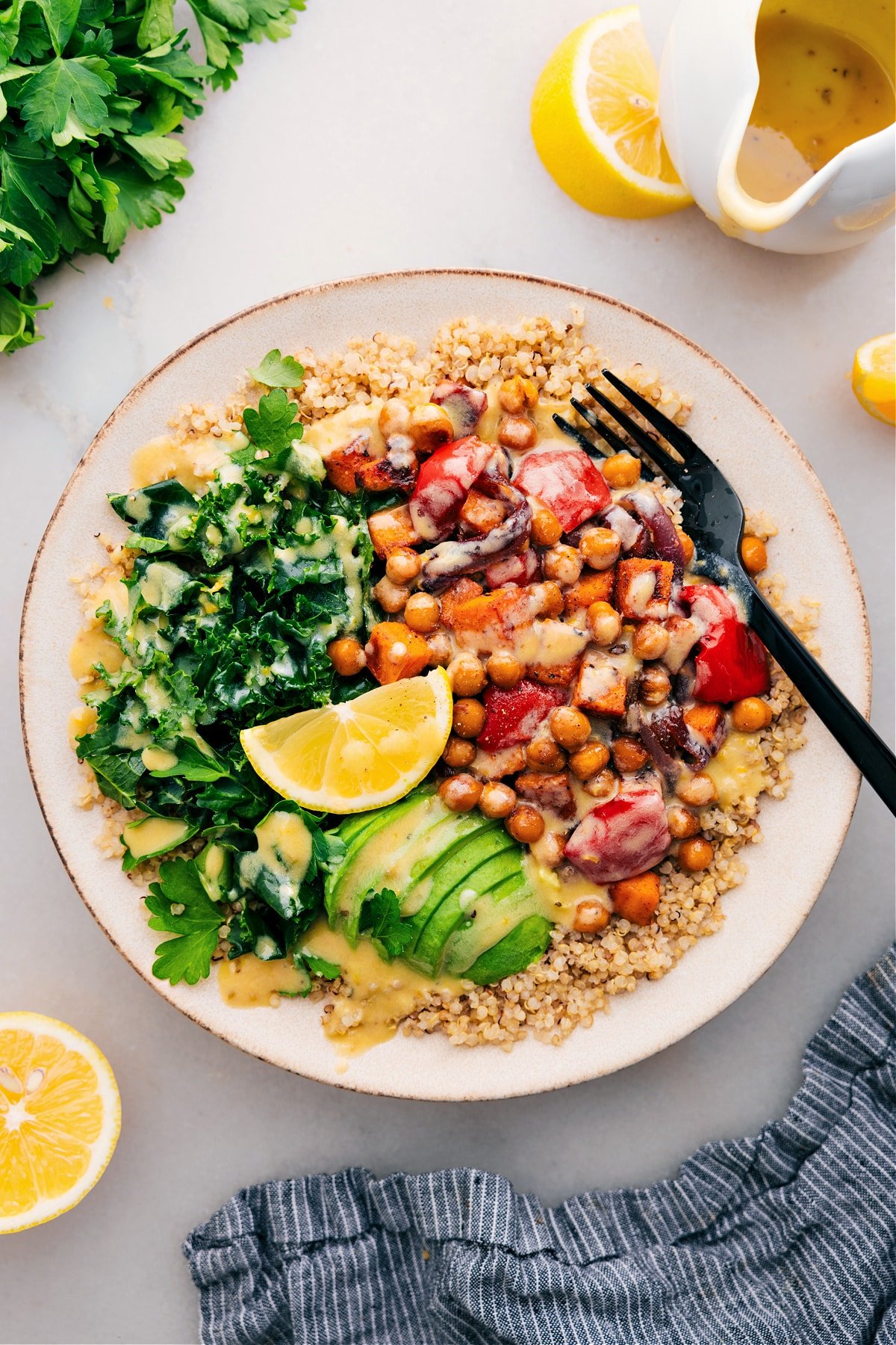 The Best Buddha Bowl Recipe Ever Buddha Bowl with quinoa as the base, topped with delicious dressing and ready to enjoy.