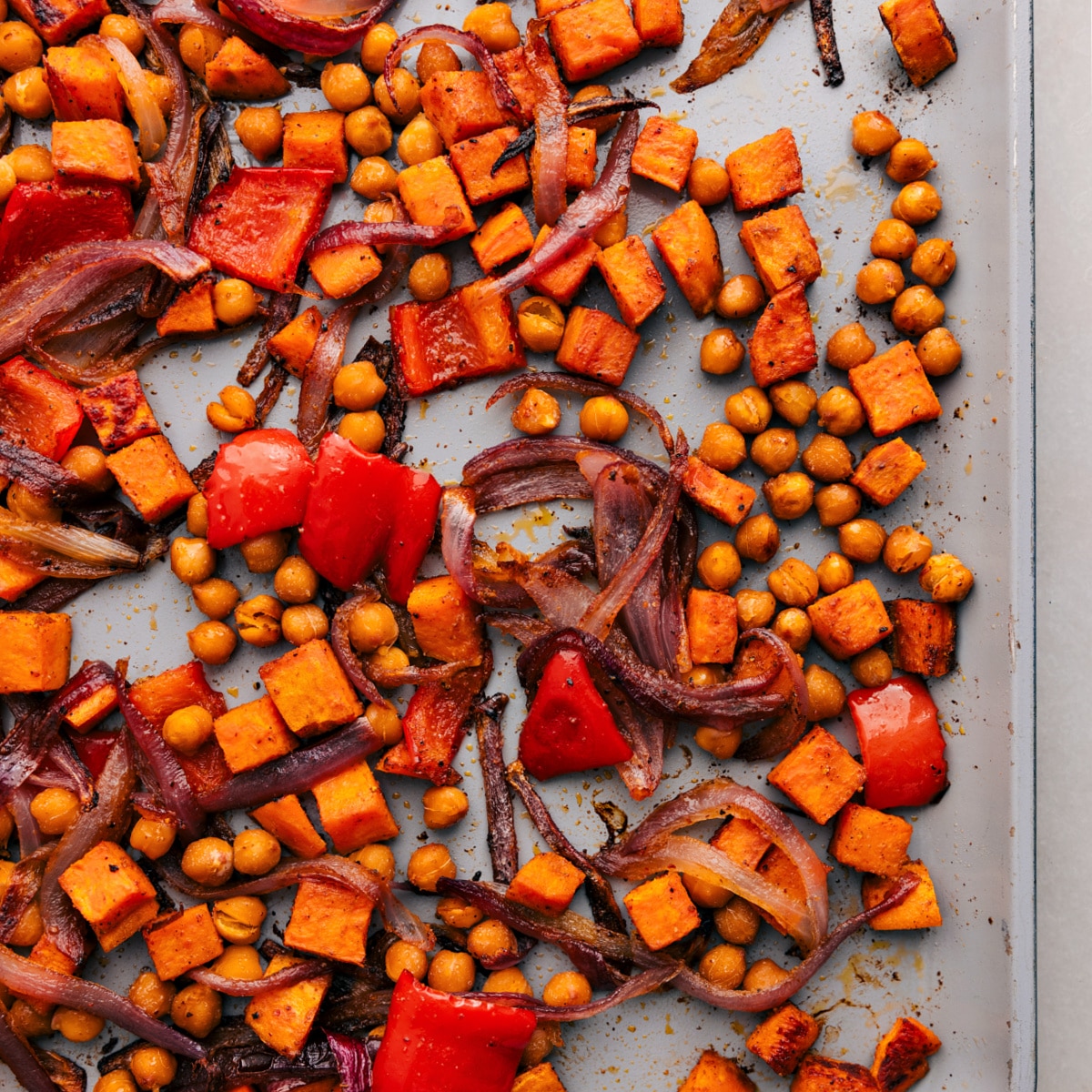 The roasted vegetables and chickpeas, fresh out of the oven, ready to add to this delicious dinner.