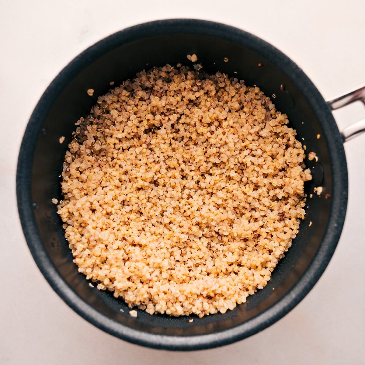 Quinoa cooked in a pot for these Buddha bowls.