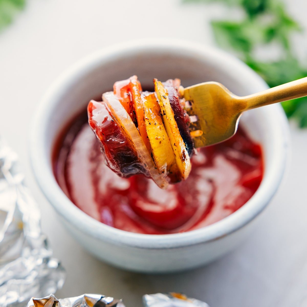 A bite of the hobo foil packets dipped in ketchup.
