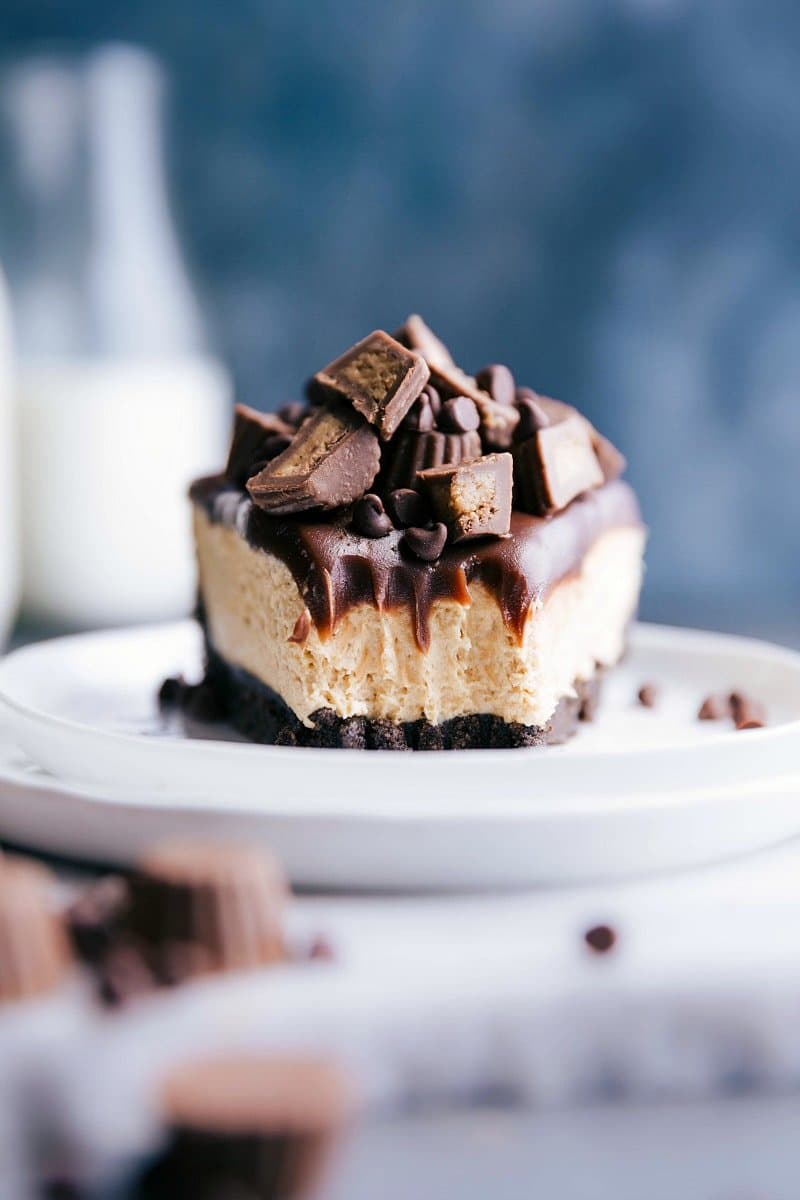 A slice of peanut butter cheesecake no bake with a bite taken out, revealing its soft and creamy interior.