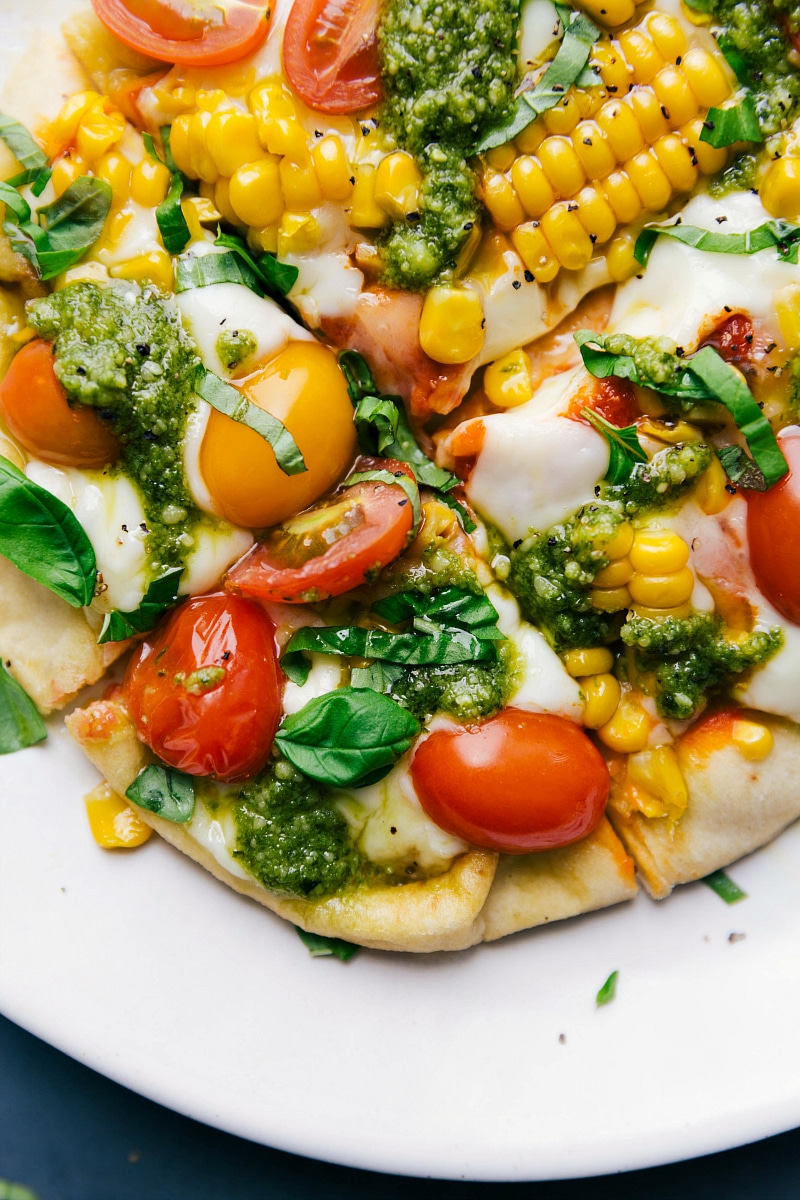 Up-close overhead view of the finished and sliced Pesto Pizza.