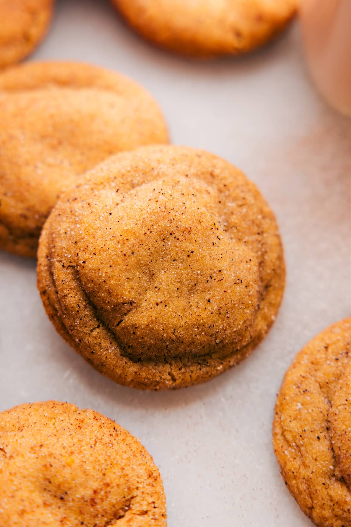 Finished pumpkin snickerdoodles, warm and fluffy, ready to be enjoyed.