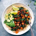 Colorful sweet potato buddha bowl, dressed and bursting with vibrant ingredients, ready to enjoy.