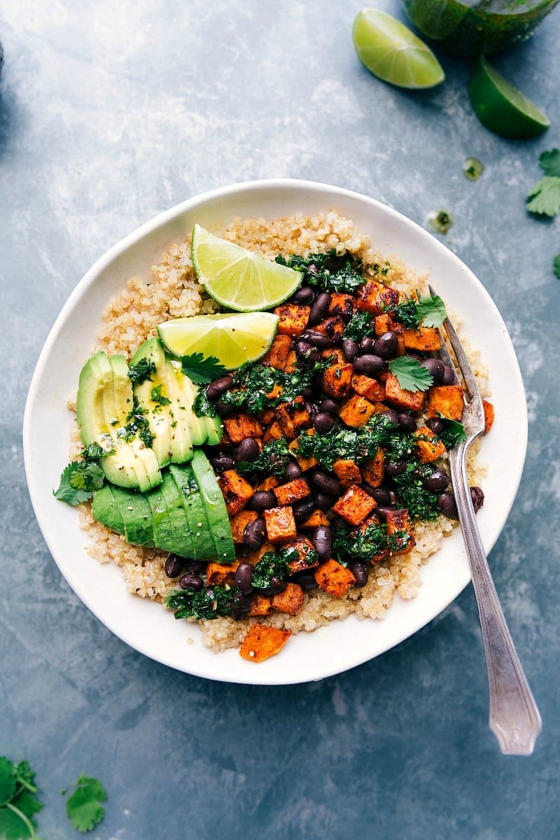 Colorful sweet potato buddha bowl, dressed and bursting with vibrant ingredients, ready to enjoy.