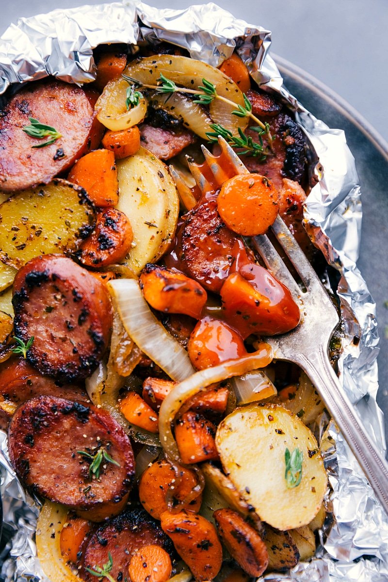 Cooked meal with tender onions, sausage, and other hearty ingredients.