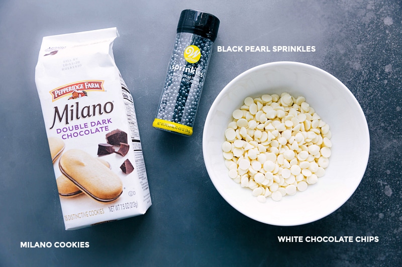 Milanos, sprinkles, and white chocolate chips laid out, ready to be used for creating adorable festive treats.