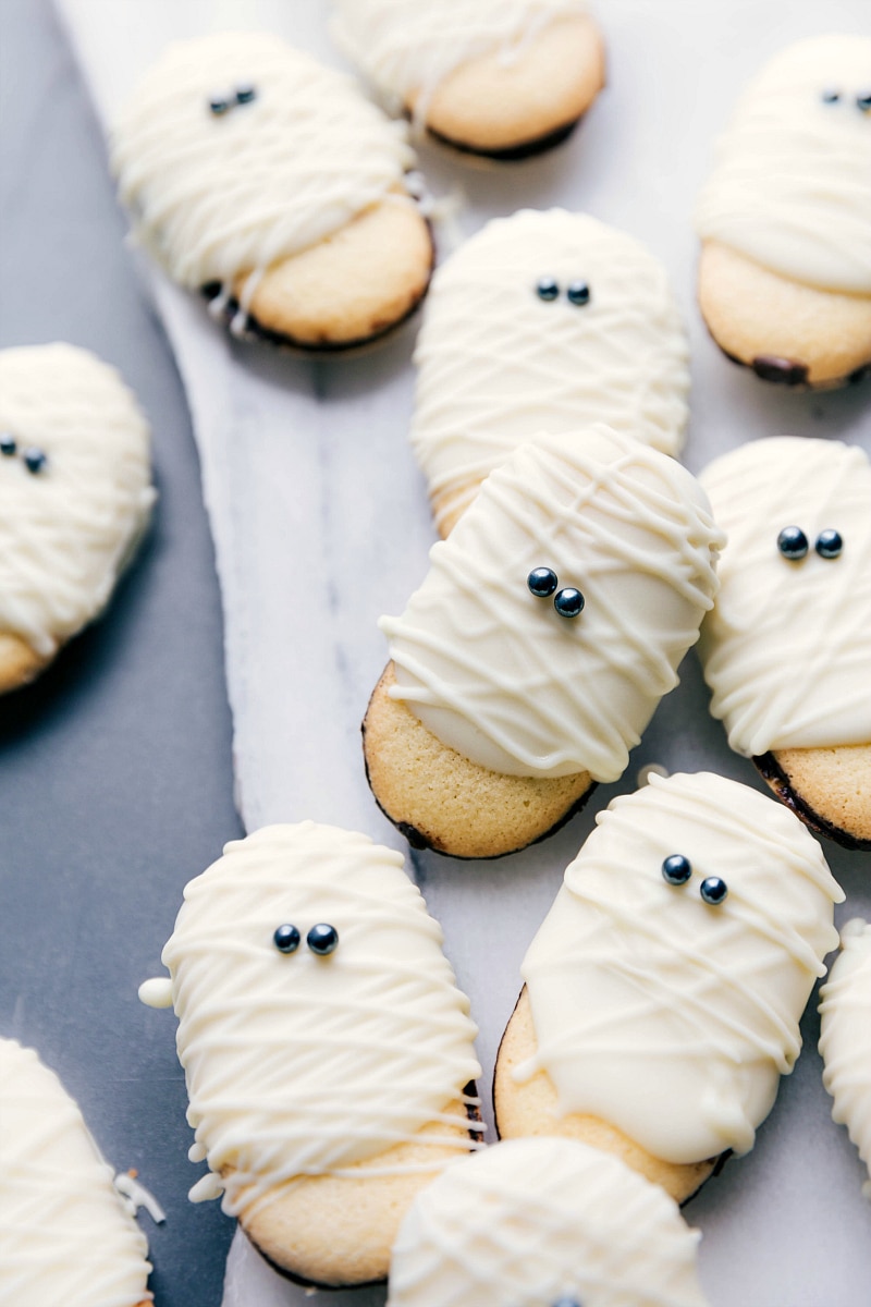 Finished treats laid out on a board, perfectly decorated for spooky parties.