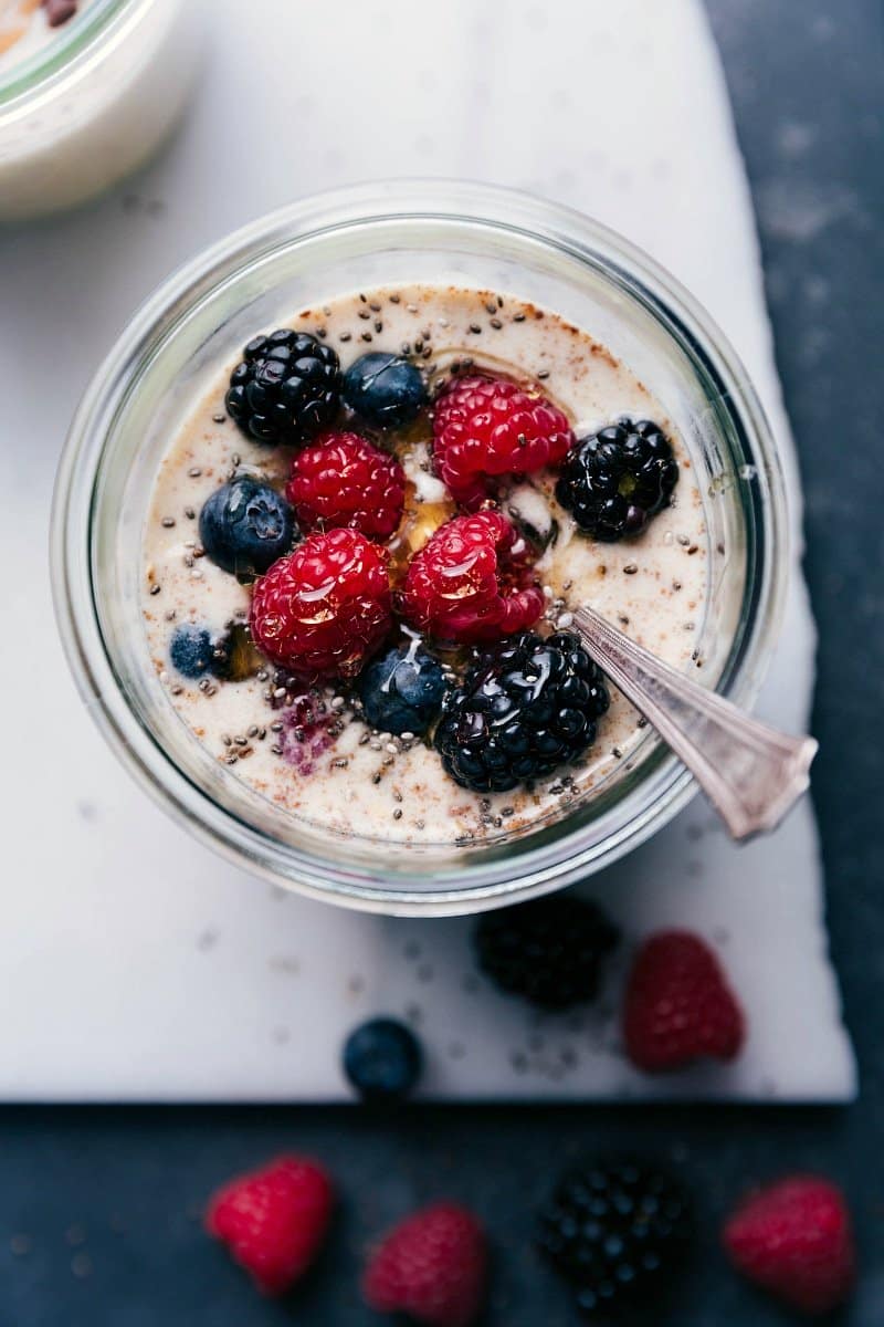 Berry overnight oats, healthy and ready for on-the-go consumption, topped with an assortment of fresh berries.