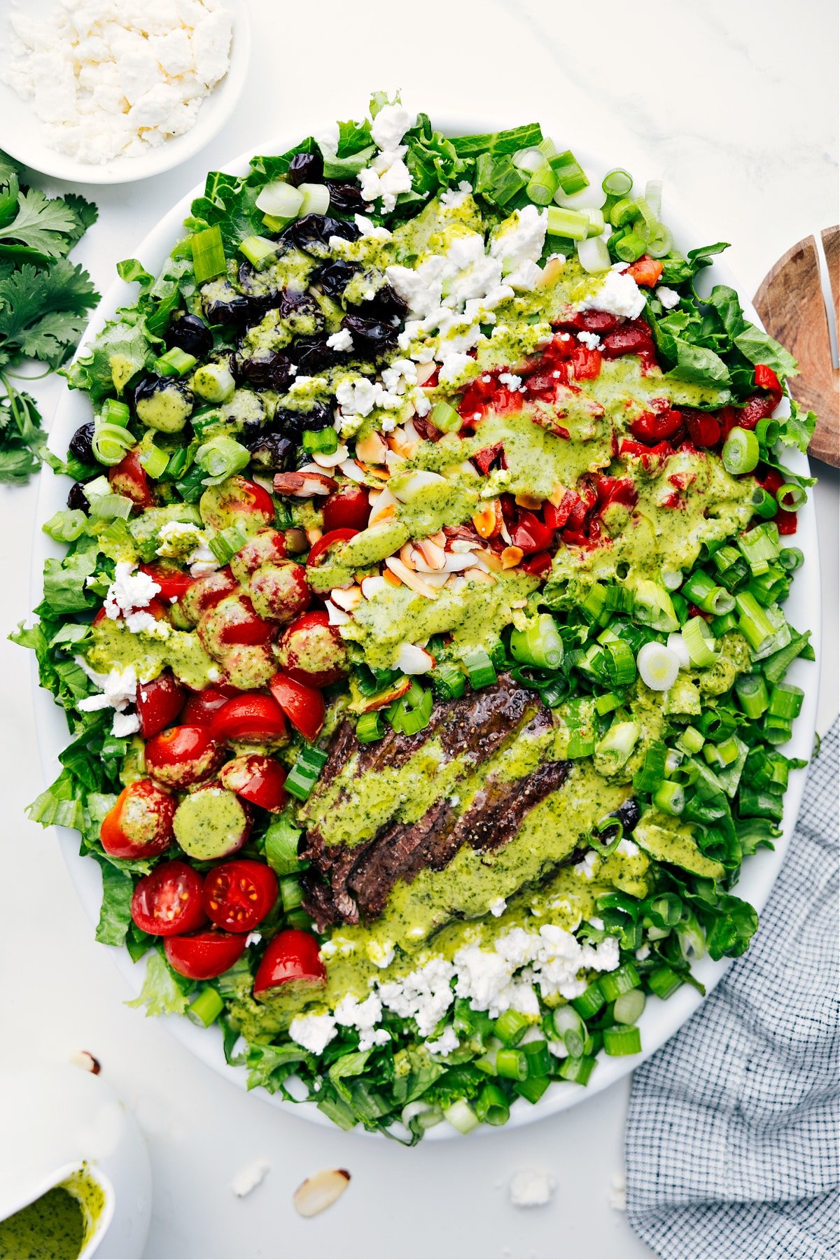 Preparing to Toss: Freshly Dressed Steak Salad with Vibrant Vegetables