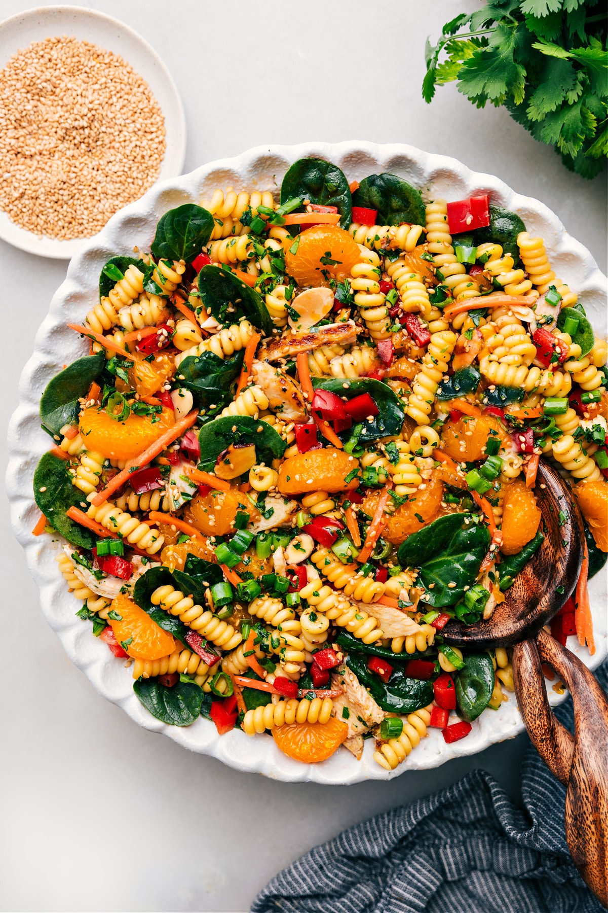 The Best Asian Pasta Salad Recipe Asian Pasta Salad dressed and tossed together in a bowl.