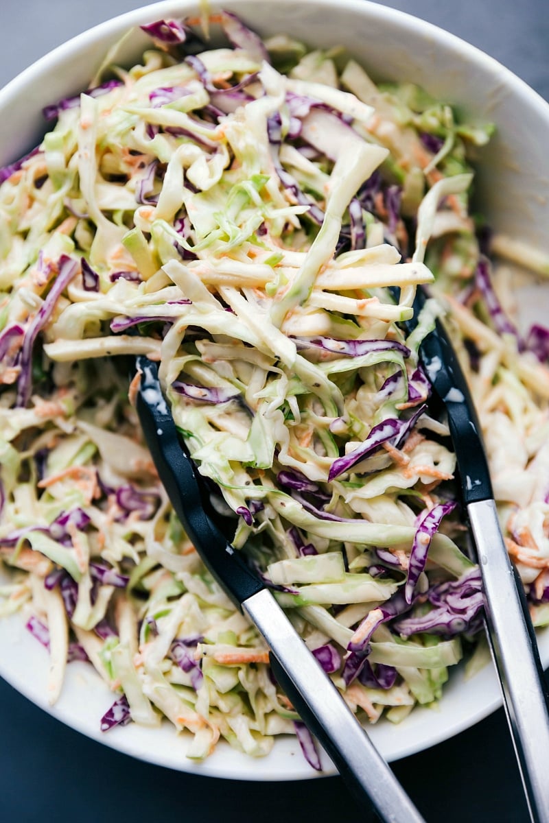 Coleslaw in a large serving bowl, fully dressed and ready for enjoyment.