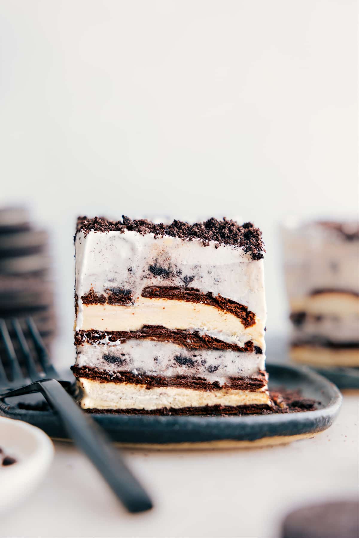 Four-Ingredient Ice Cream Sandwich Cake Recipe Four-ingredient Ice Cream Sandwich Cake slice on a plate.