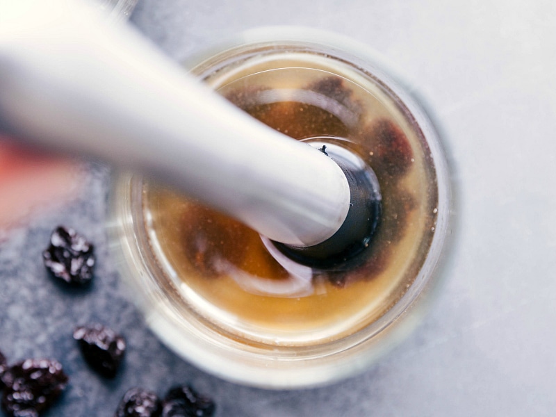 Overhead image of the juice and dried cherries being muddled together