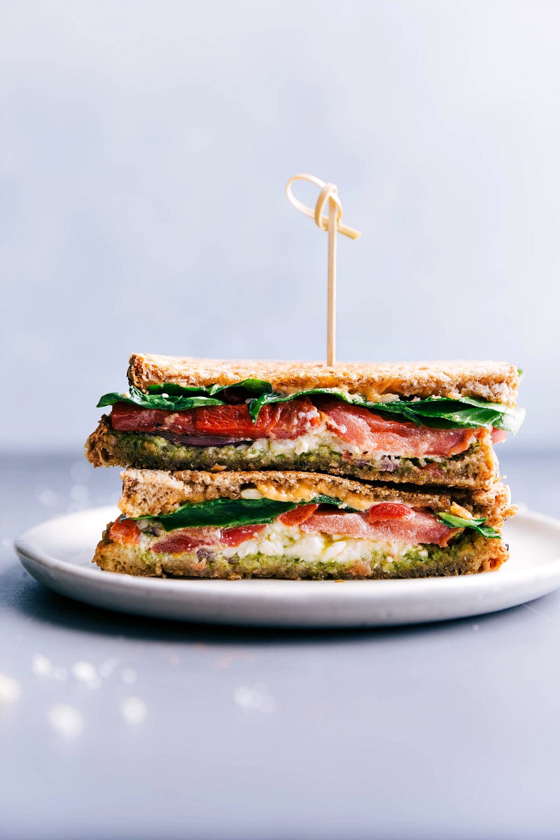 Mediterranean Sandwich, packed with flavors and vegetables, cut in half and ready to be enjoyed.