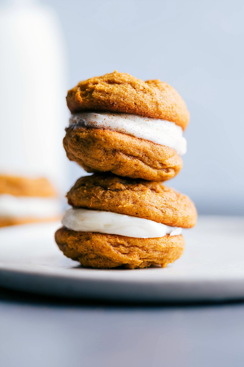 Image of two pumpkin whoopie cookies stacked on top of each other