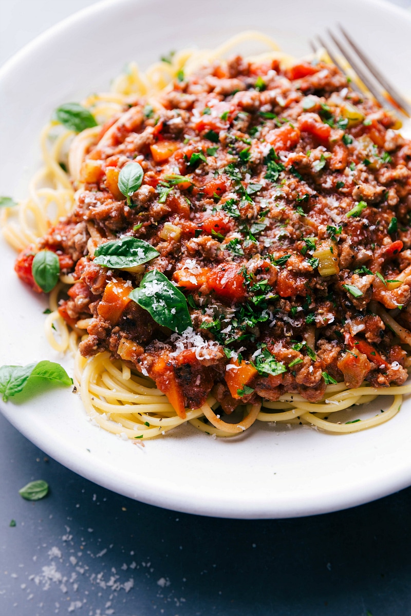 View of a plate of spaghetti topped with Turkey Bolognese.