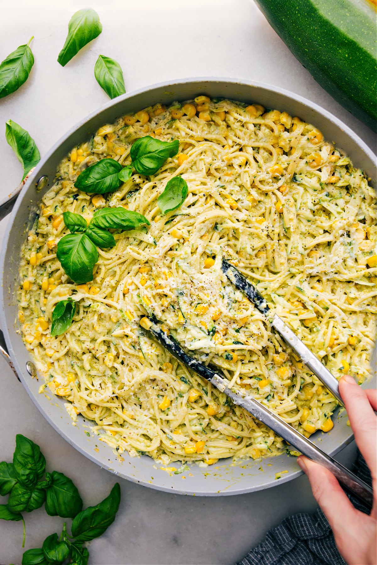 The Best Zucchini Pasta Sauce To Use Up Your Zucchini Bounty Zucchini Pasta Sauce over spaghetti in a pot ready to be served for dinner.