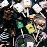 An assortment of Halloween Rice Krispies Treats, decorated in fun and spooky designs.