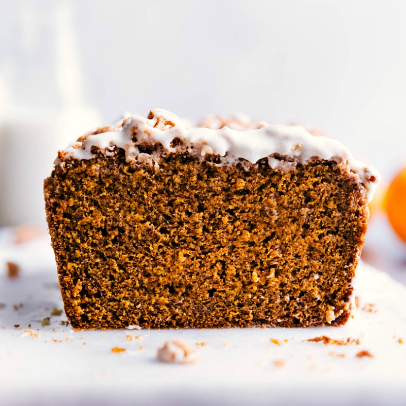 Up-close image of Pumpkin Bread with Streusel Topping and the glaze freshly added on top.