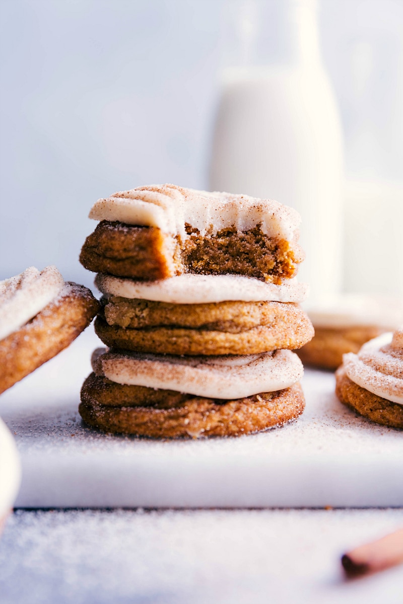 Image of Pumpkin Cinnamon Roll Cookies stacked on top of each other.