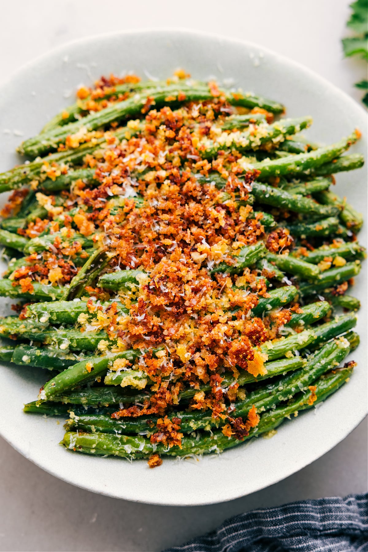 Freshly roasted green beans, hot out of the oven and ready to be enjoyed on a tray.