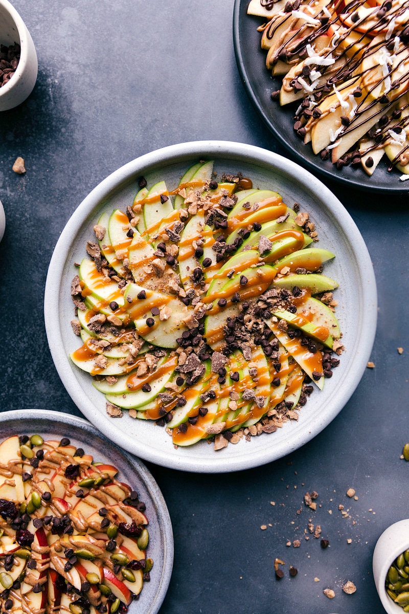 Apple Nachos are the best after-school snack ever! Easy to make, impressive to look at, and super delicious and kid friendly! Recipe via ChelseasMessyApron.com #apples #nachos #applenachos #afterschool #snack #fruit Overhead image of Apple Nachos