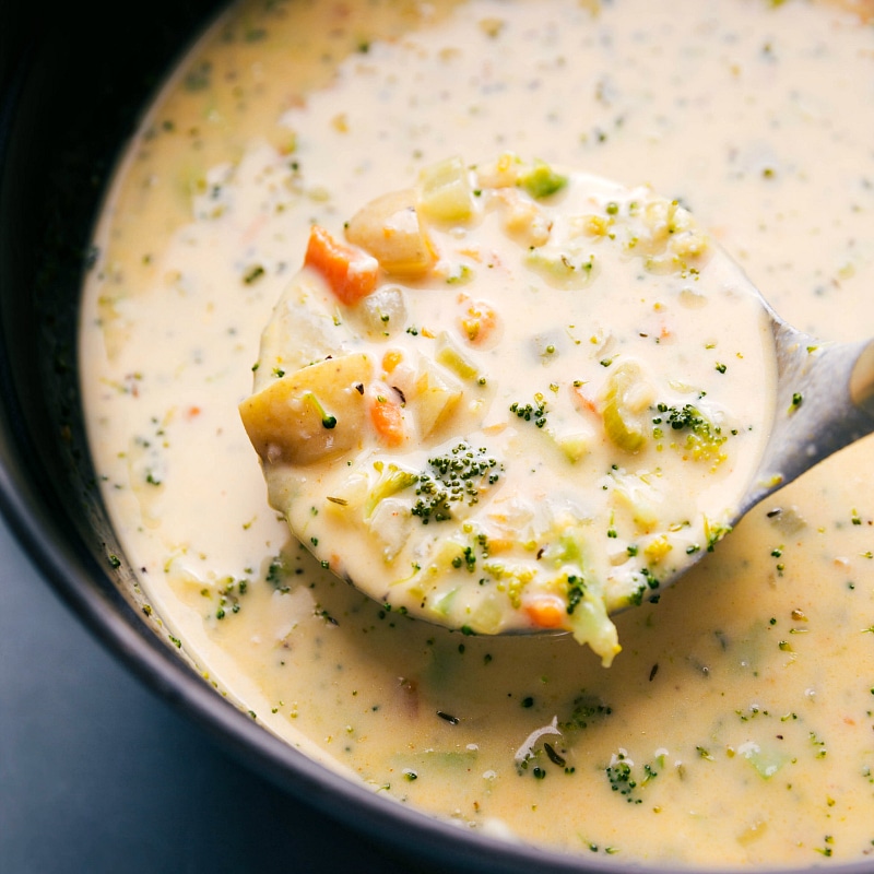 Image of the soup being scooped up by a ladle 