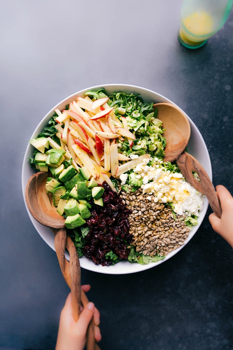 Brussels sprout salad in a bowl, adorned with delicious and healthy toppings.