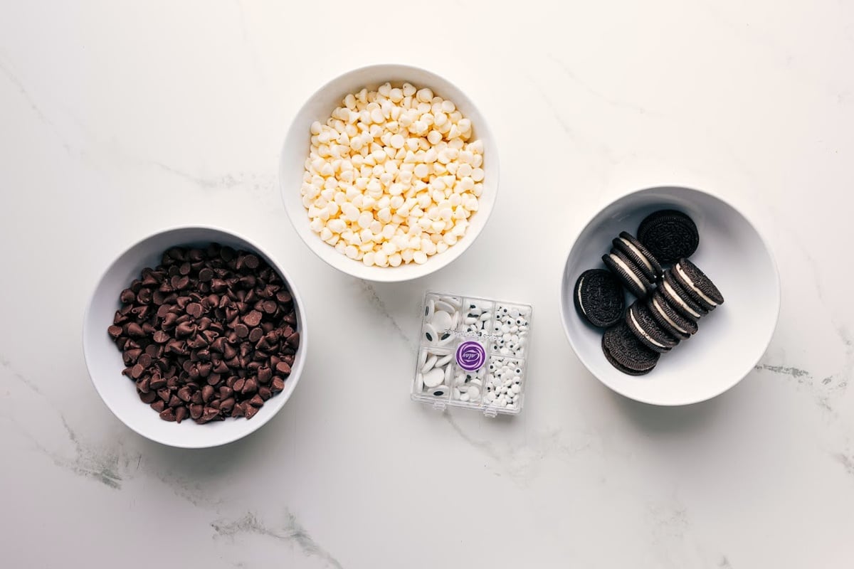 All the ingredients in this recipe prepped out for easy assembly including the chocolate chips, eyes, and Oreos.